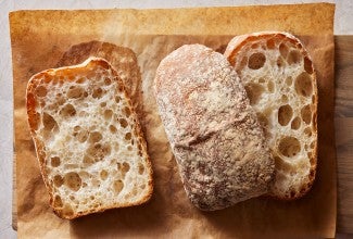 A few loaves of Pan de Cristal showing their open crumb